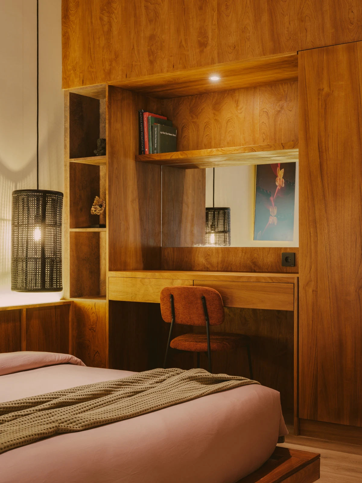 Custom teak vanity desk with built-in shelving and woven pendant light
