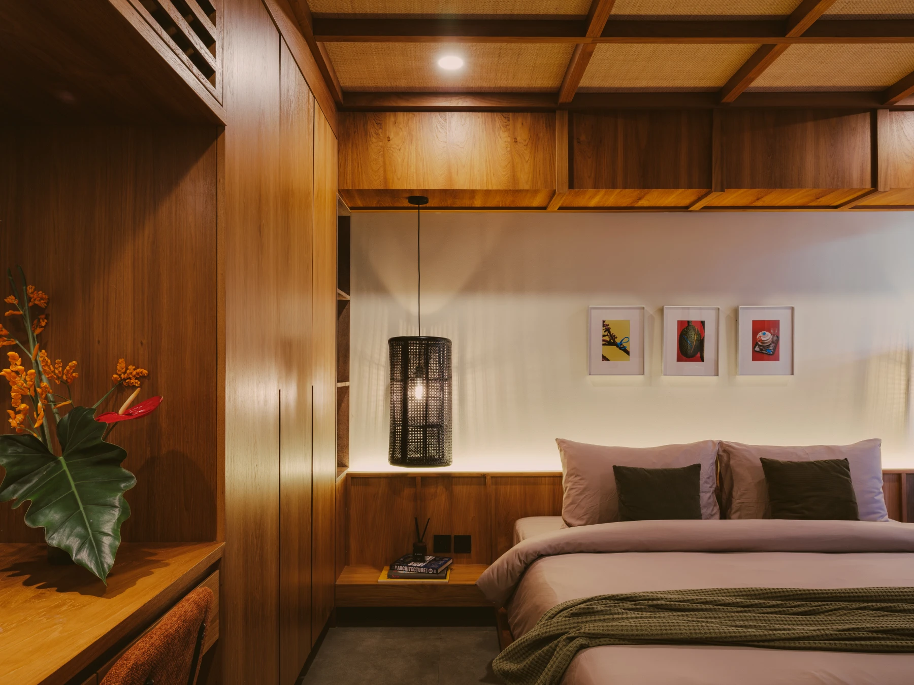 Wood-panelled bedroom interior with woven pendant lighting and artisanal details