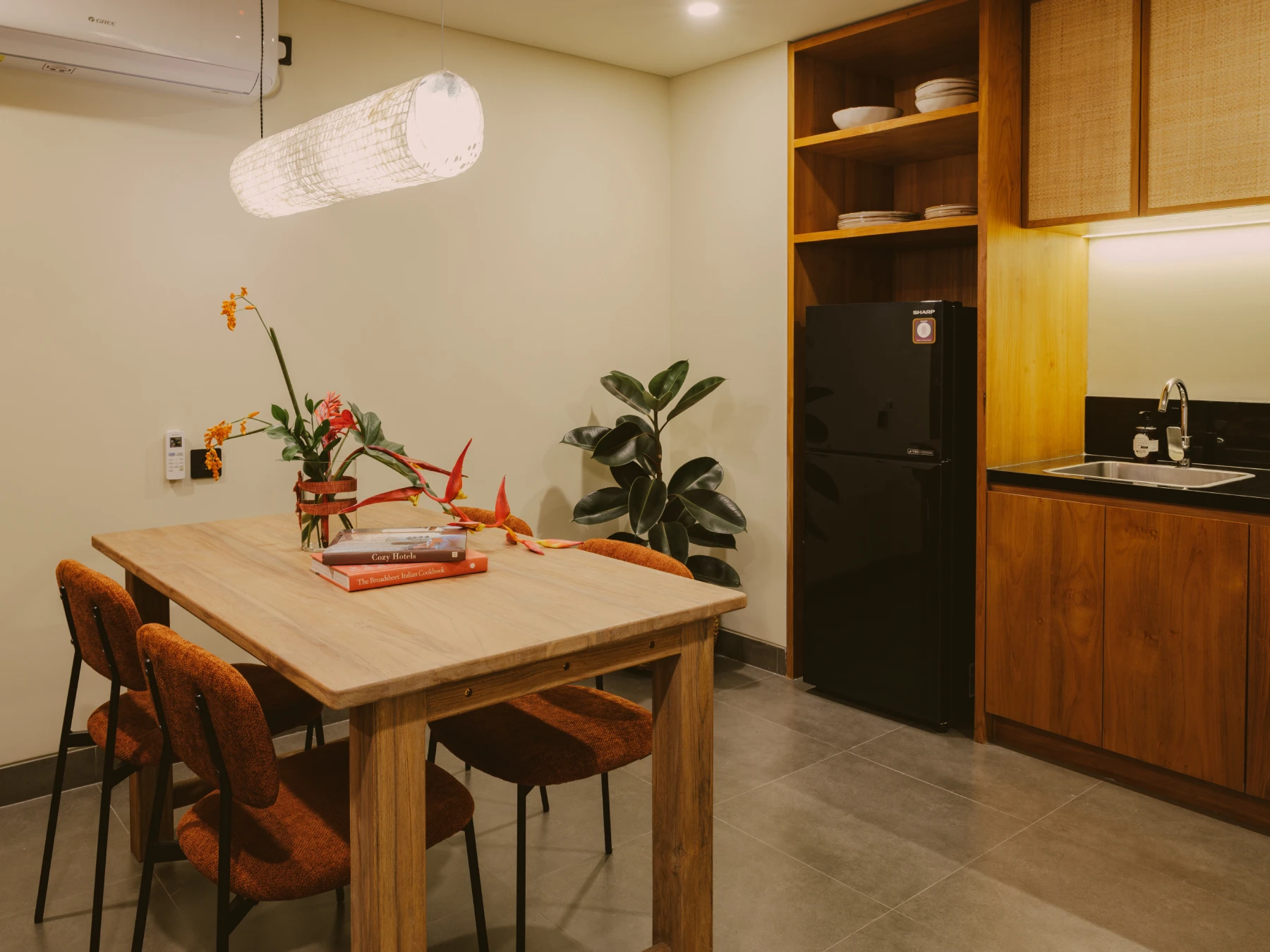 Solid timber dining setting and fully equipped apartment kitchen