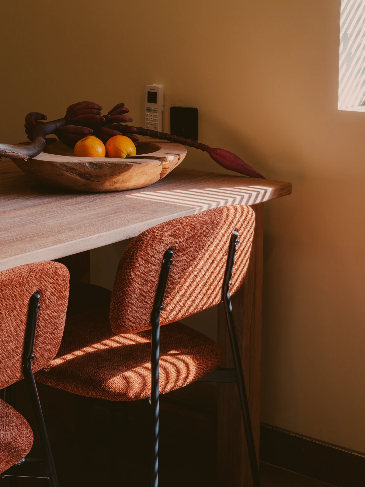 Premium Studio Apartment Mezzanine dining area with warm morning sunlight